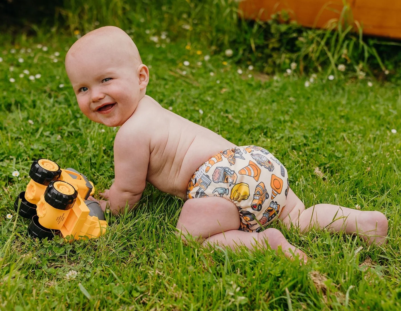 Close-up of the Construction Derby print on the Fluffy Ducks nappy