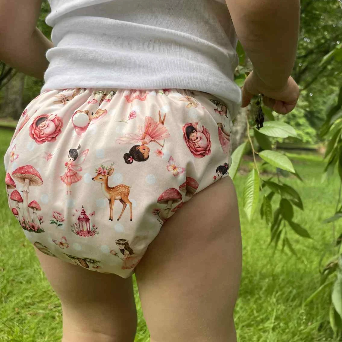 Close-up of the Fairy Forest print on a reusable cloth nappy