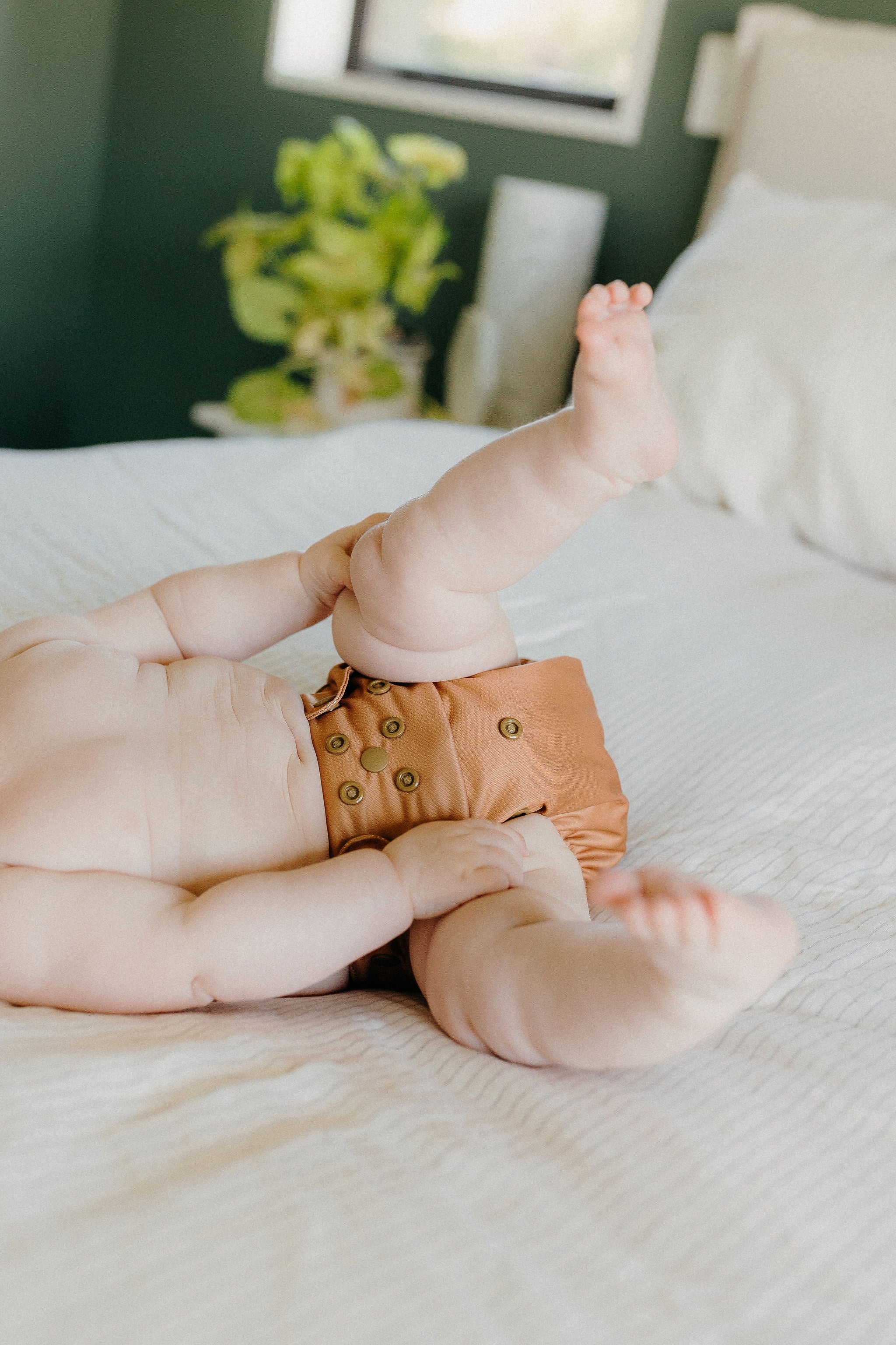 Close-up of the Mustard OSFM nappy showcasing waterproof exterior