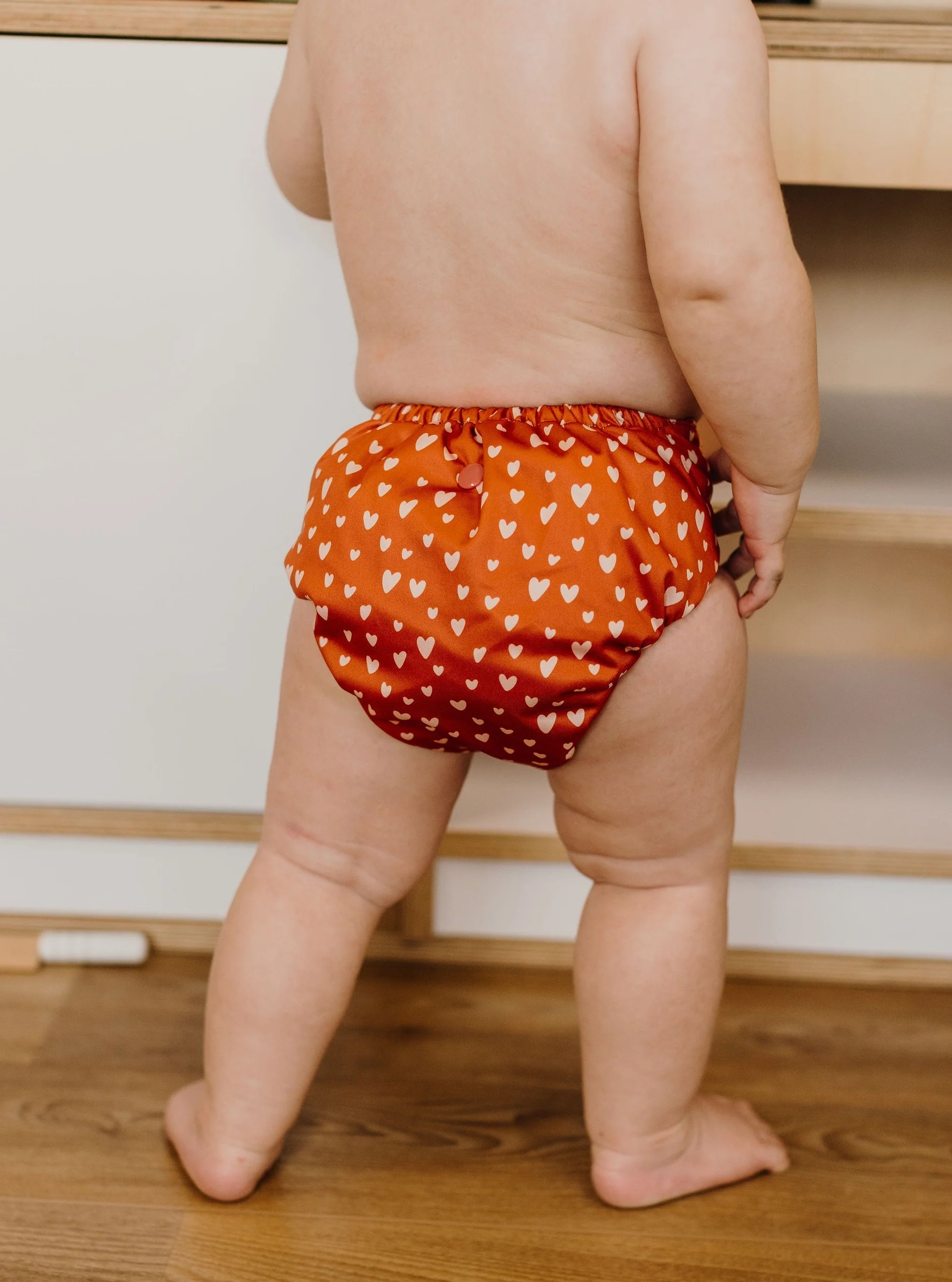 Close-up of the Rustic Hearts print on a Fluffy Ducks nappy