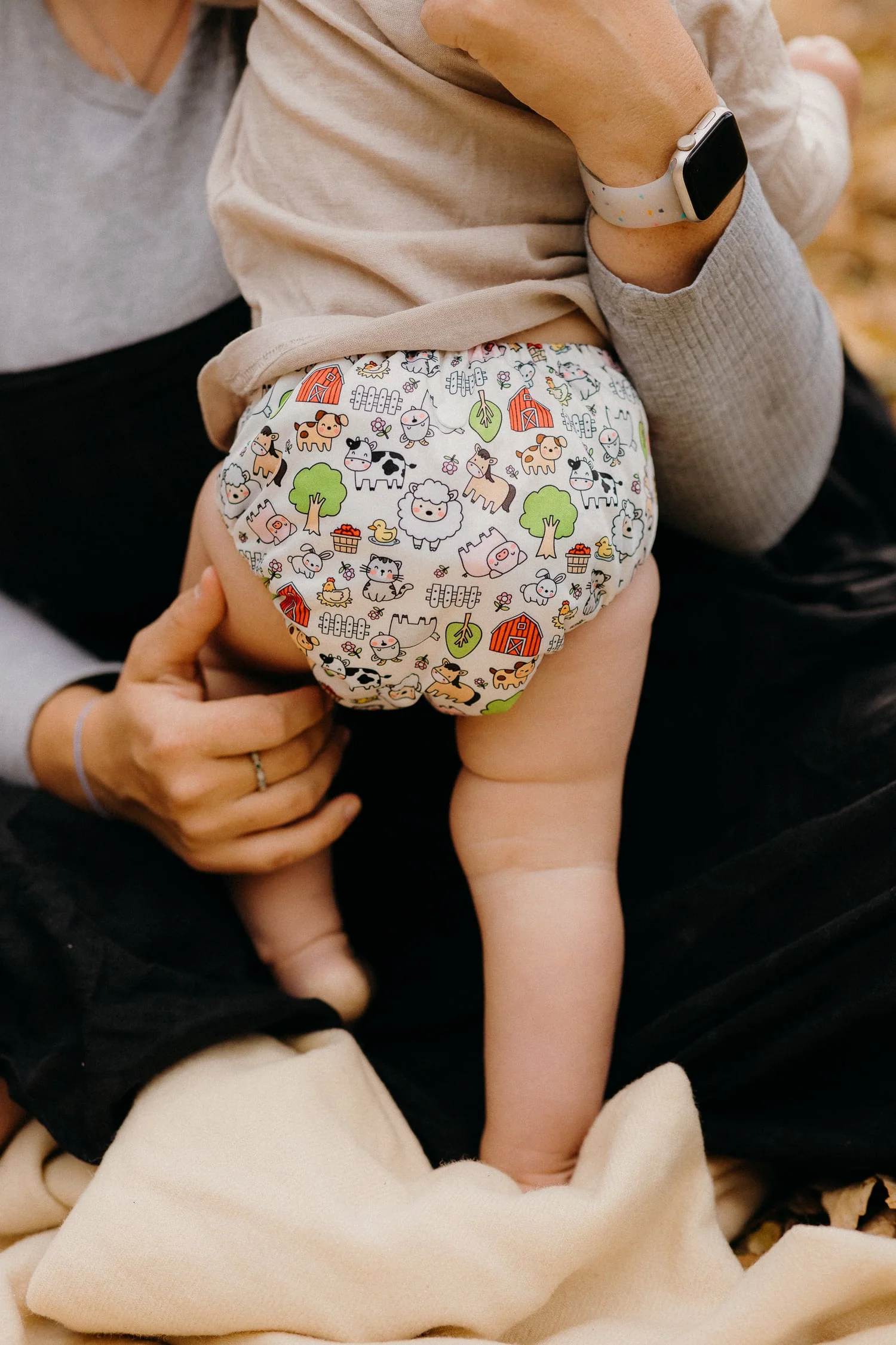 Close-up of the snap buttons and bamboo terry inserts of the nappy
