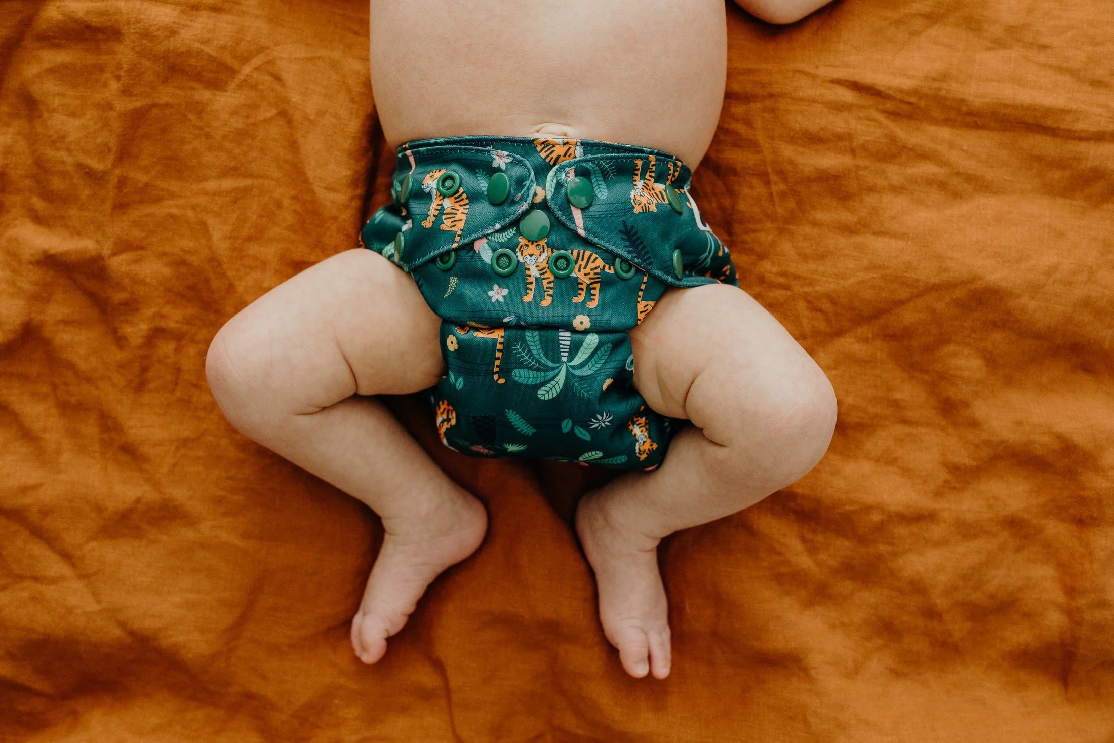 Close-up of snap buttons on Jungle Nights nappy