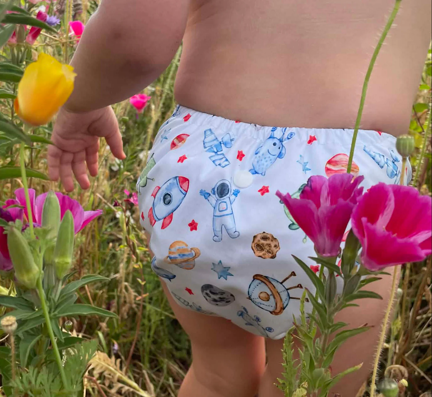 Close-up of Outer Space print on Fluffy Ducks nappy showing absorbent layers
